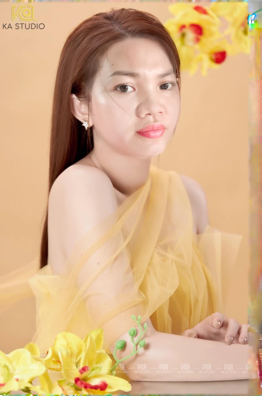 a close up of a woman with a yellow dress and flowers, wearing wheat yellow gauze, with yellow cloths, beautiful yellow woman, portrait image, elegant yellow skin, ao dai, profile photography, mai anh tran, in style of lam manh, photo taken with canon 5d, yellow hue, studio photoshot, nivanh chanthara