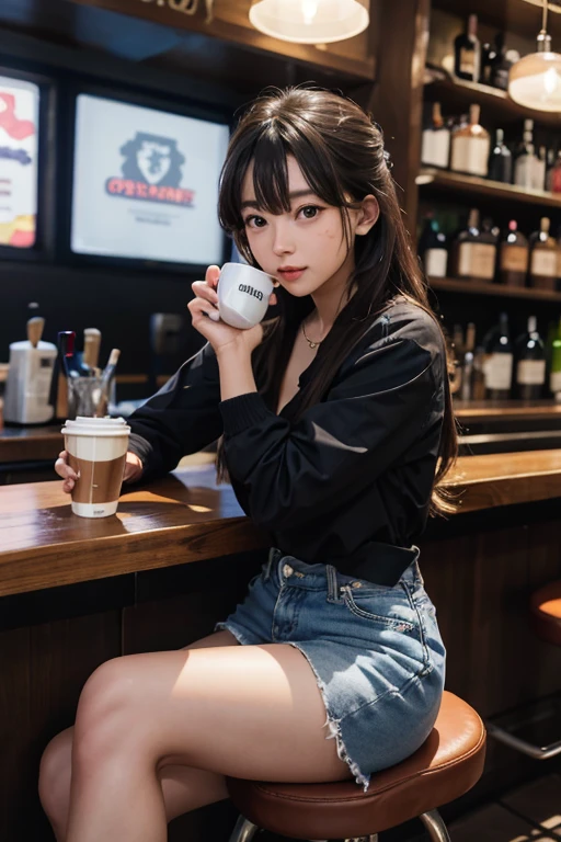A girl sitting at the bar drinking coffee
