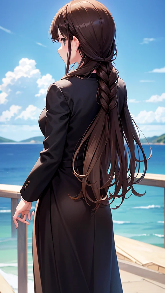 Brown haired woman with braid on right side Standing in an all black suit, standing with your back looking at the beautiful view of the sky.