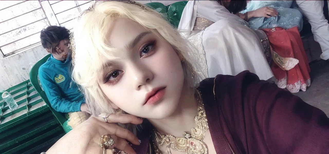 Girl, blonde hair, gray eyes, sharp features, white skin, pink lip, sweater