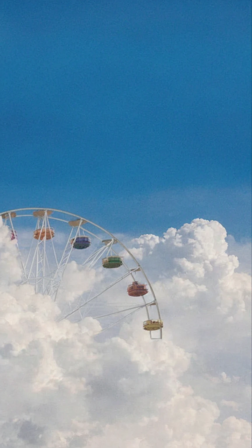 This image is whimsical and dreamlike, evoking a sense of wonder and lighthearted escapism. Here's a breakdown of what makes it work:
Surreal Composition: A Ferris wheel, a symbol of joy and excitement, appears to be floating amongst fluffy white clouds. This impossible placement immediately transports the viewer into a fantastical realm where the ordinary rules of physics don't apply.
Color Palette and Lighting: The image uses a soft, pastel color palette. The bright, almost cloudless blue sky creates a sense of expansiveness and freedom. The white clouds, tinged with subtle hints of pink and yellow from the setting sun, add to the dreamy, otherworldly atmosphere.
Sense of Height and Movement: The Ferris wheel is positioned high in the frame, further emphasizing the sense of weightlessness and freedom. The suggestion of the Ferris wheel's slow, gentle rotation adds a touch of tranquility and invites the viewer to imagine themselves riding along, drifting through the sky.
Minimalism and Open Interpretation: The image's simplicity allows for personal interpretation. It could evoke childhood memories, dreams of adventure, or a longing for carefree moments.
Overall, the image is a delightful visual treat that sparks joy and invites daydreaming. It's a reminder to embrace the whimsical and to find magic in the unexpected.