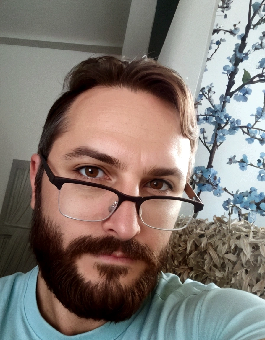 White background, man, glasses, selfie, beard, brown hair, brown eyes, black glasses, blue shirt