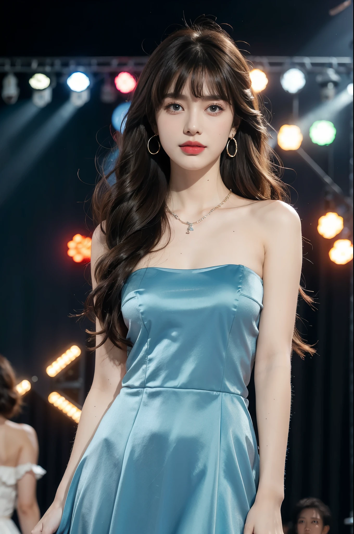 1girl,bangs,bare shoulders,necklace,strapless blue dress,detailed background,detailed eyes,brown hair,earrings,upper body,jewelry,slim,flat chest,messy hair,looking at viewer,makeup,night scene,red lips,signature,laughing,solo,standing,On the T-stage,catwalk,fashion show,Surrounded by crowded crowds on both sides of the stage,neon lights