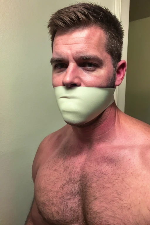 middle-aged handsome man, slightly fat, half body, hairy chest, naked, short brown hair, stubble, facial hair, bearded, sad, looking at camera, tape gag, tape wrapped, wrap gag, tightly bound, tape wrapped around face