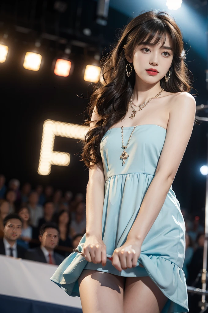 1girl,bangs,bare shoulders,necklace,strapless blue dress,detailed background,detailed eyes,brown hair,earrings,close-up of face,jewelry,slim,flat chest,messy hair,looking at viewer,makeup,night scene,red lips,signature,laughing,solo,standing,On the T-stage,catwalk,fashion show,Surrounded by crowded crowds on both sides of the stage,neon lights