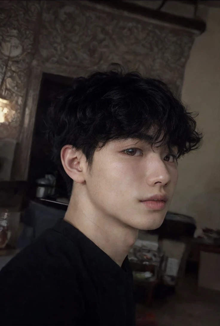 Asian boy, with curly, dark 