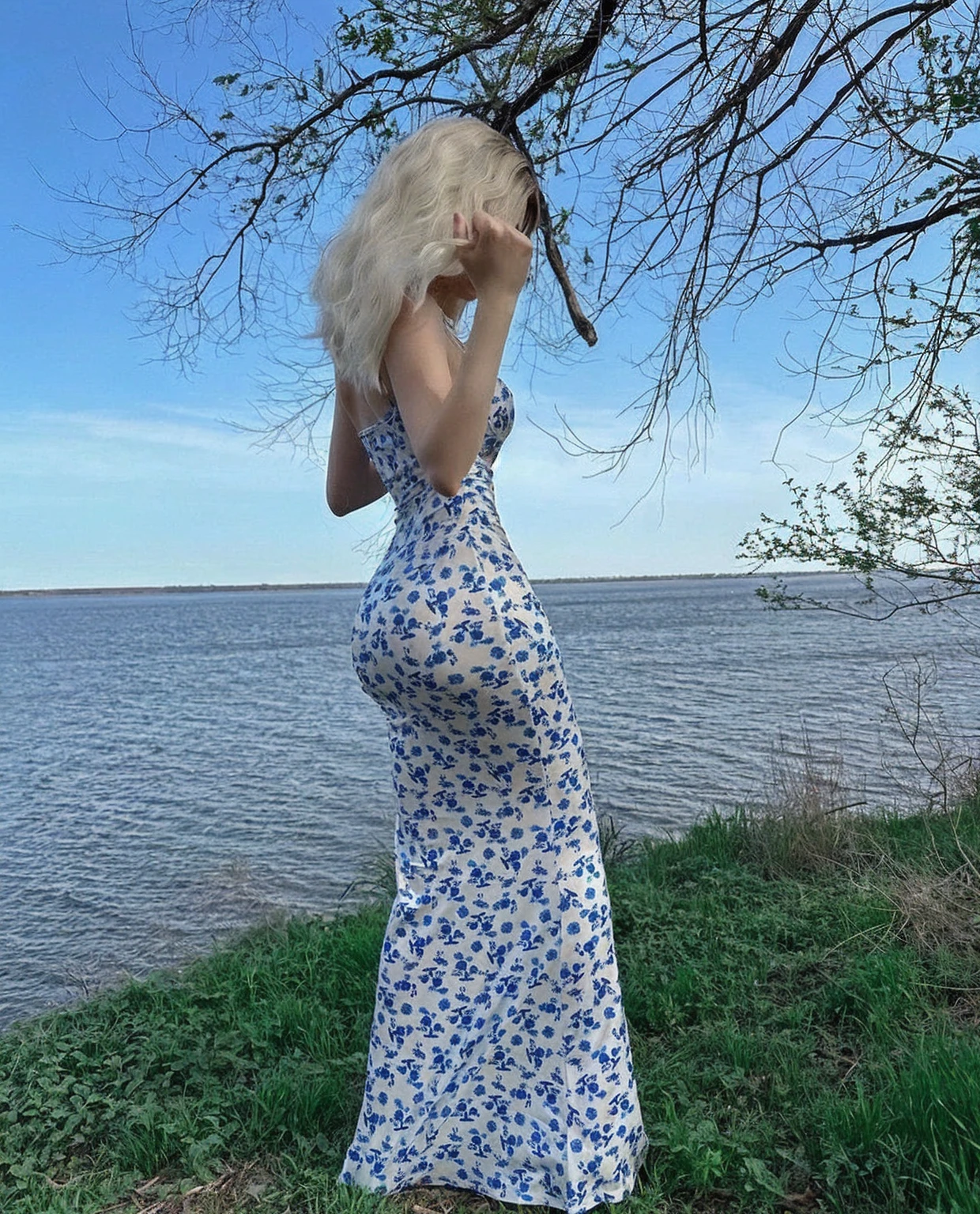 Alafe woman in a blue and white dress stands by the water, Wearing a long floral dress, Blue and white dress, ่่ฒLong skirt, wearing a Long skirt, Long skirt, Wearing Anya Taylor - Joy, The album cover, Ava Max, ๐คฌ ๐คฎ ๐ ๐, Flowing hair standing on the rock, Long skirt female, Tube Top Dress