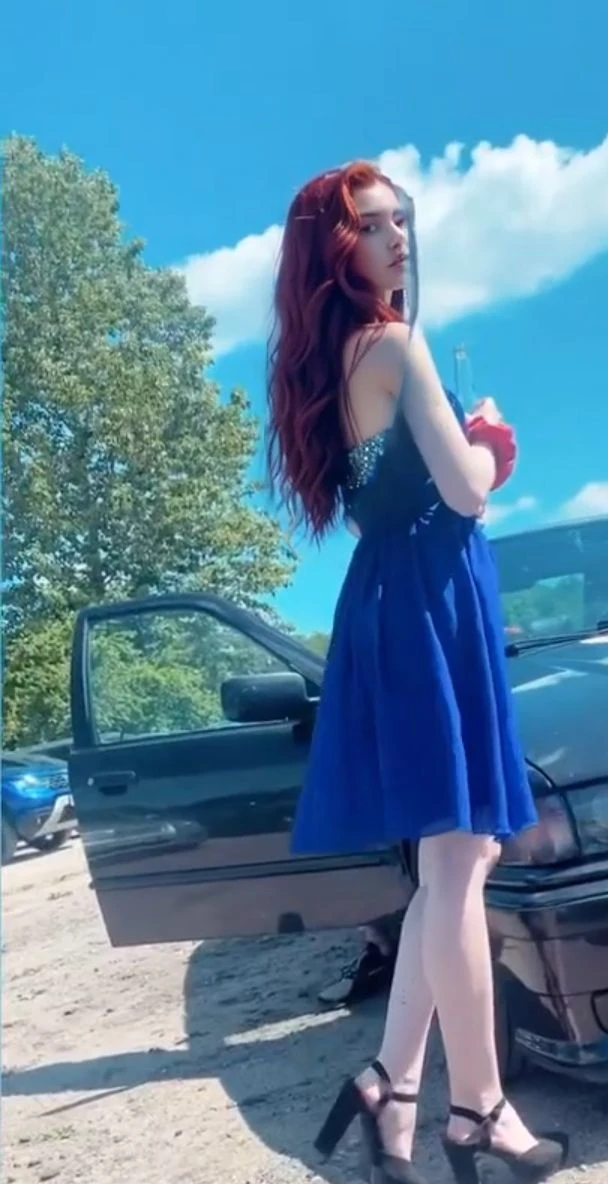 (((Masterpiece))), 25-year-old Caucasian French girl with shoulder-length messy red hair, adorned with crystal glow, blooming hair akin to . Certainly!