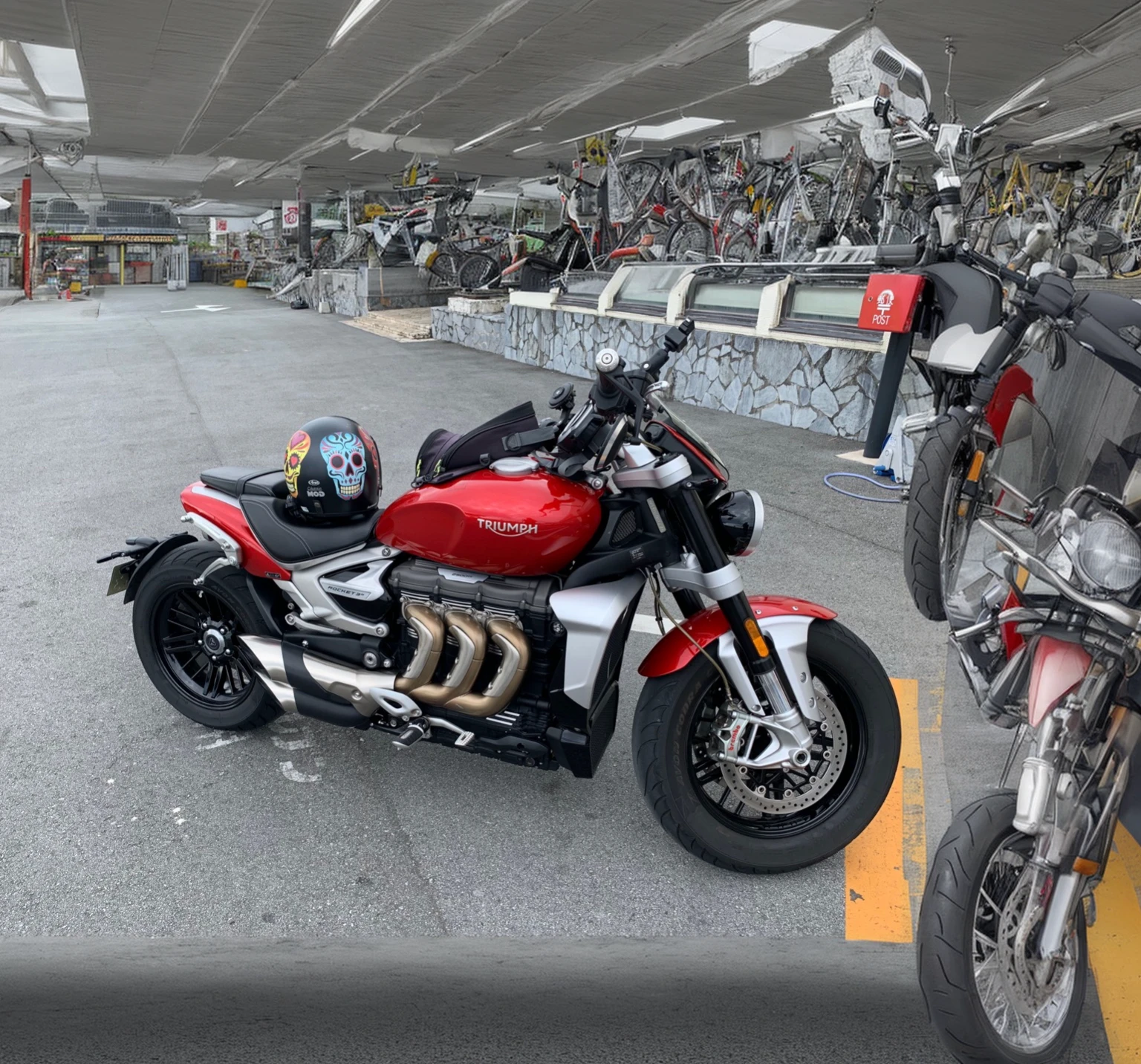 Motorcycle at convienience store with bikini girls