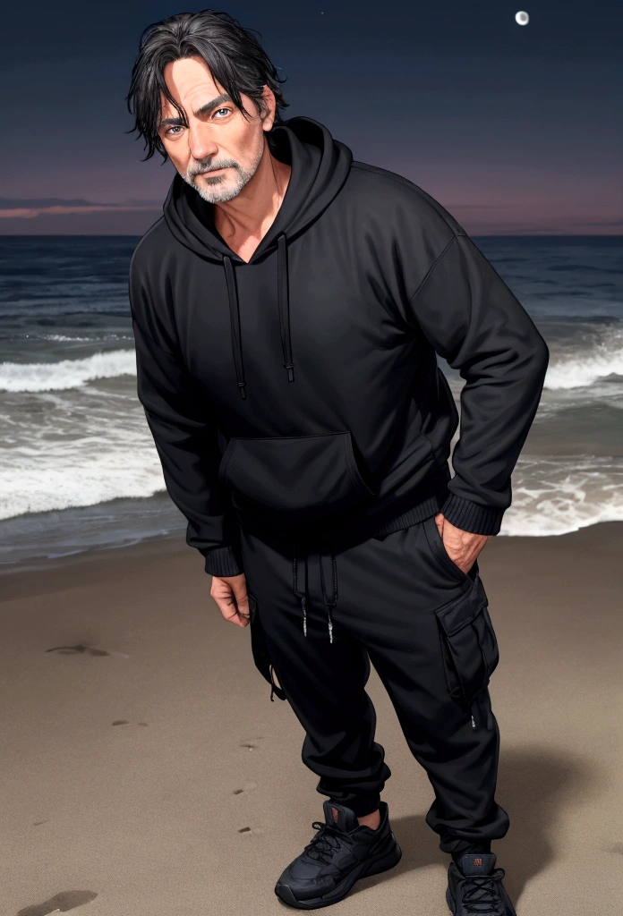 a 55 year old man with dark hair and blue eyes and a black hoodie and black cargo pants at night at the beach
