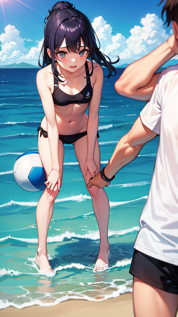 A girl and a guy play ball in the sea