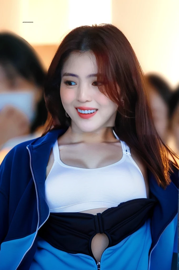 woman wearing white sports bra, lean body, blue sports jacket