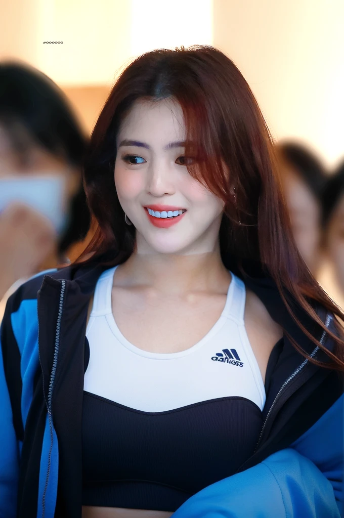 woman wearing white sports bra, lean body, no jacket