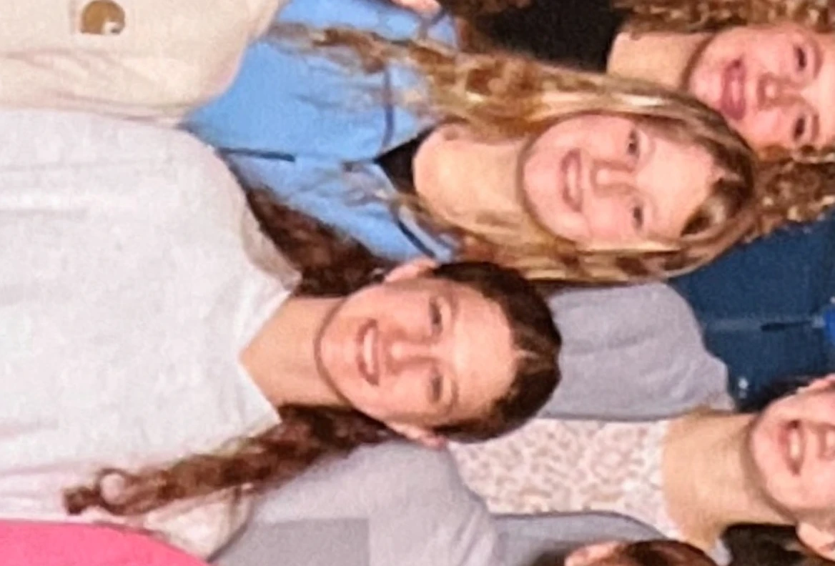 2heads, two headed girl, age 16, cute, cute outfit, wavy blonde hair, blue eyes, sitting bored in math class,