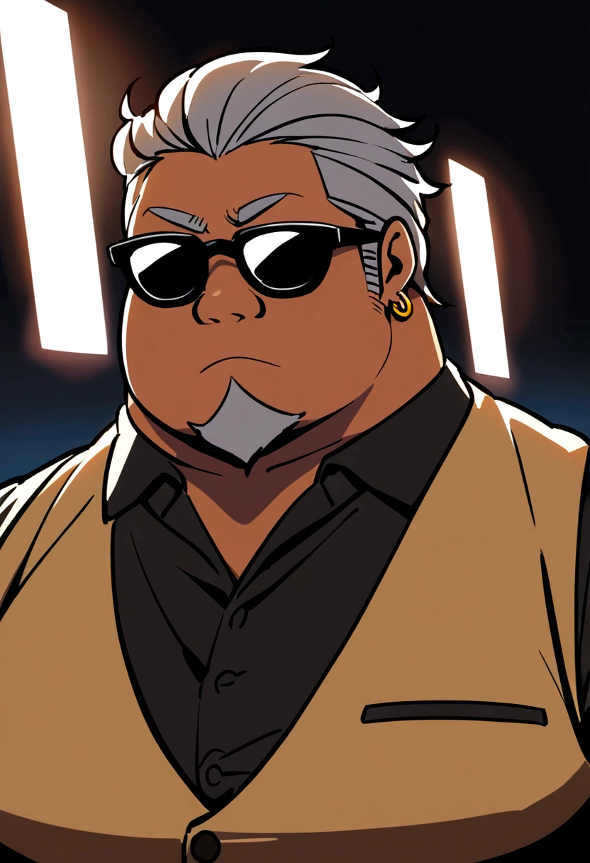 A plump man with gelled grey hair, wearing black sunglasses, a goatee, gold earrings, and a tan vest.