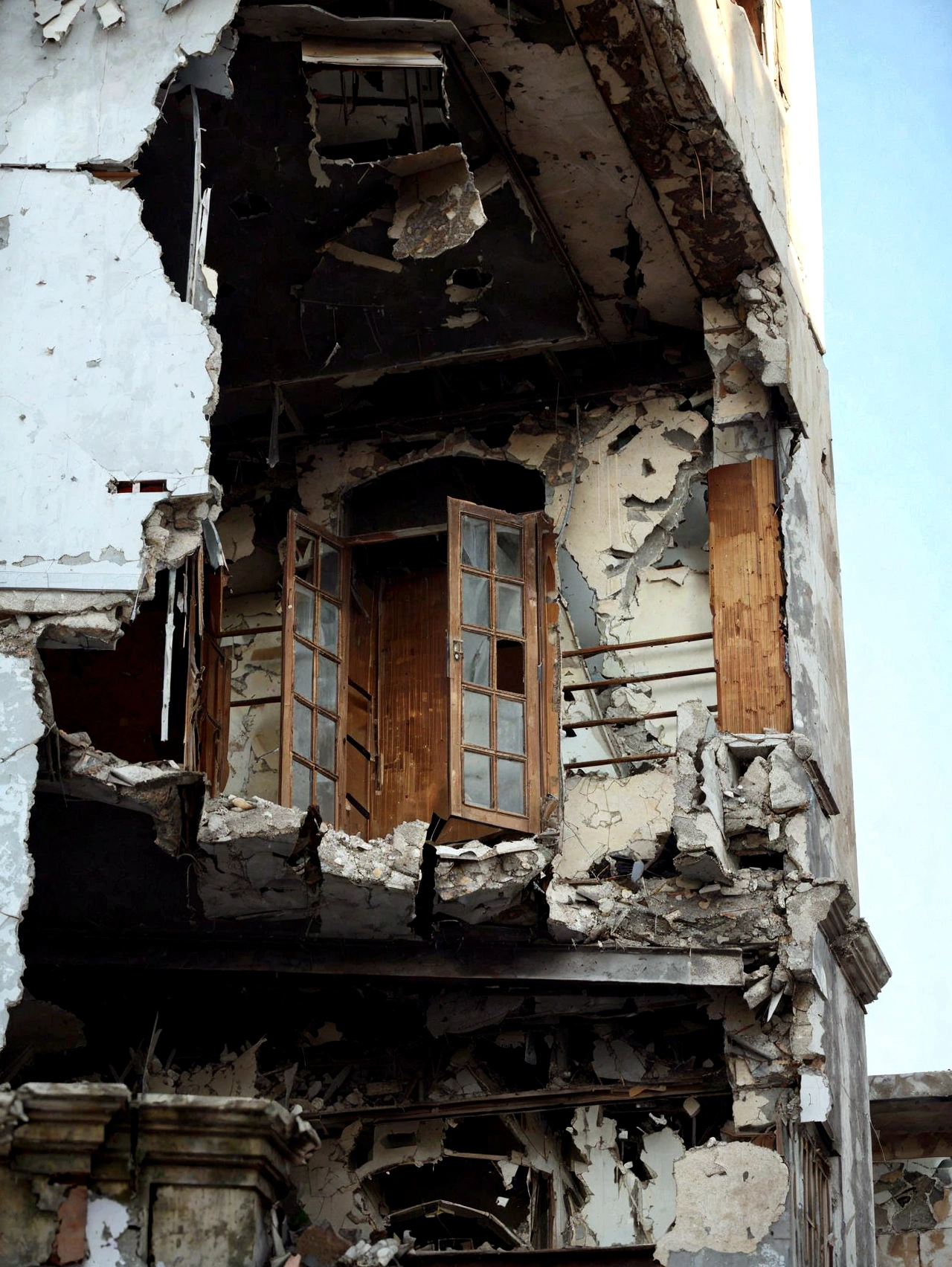 arafed building with a broken window and a broken door, building crumbling, crumbling buildings, crumbling, damaged buildings, building destroyed, damaged structures, collapsed building, destroyed buildings, broken buildings, crumbling ruins, big impact hit on the building, destroyed modern buildings, “derelict architecture buildings, wrecked buildings, dilapidated houses, ruined architecture