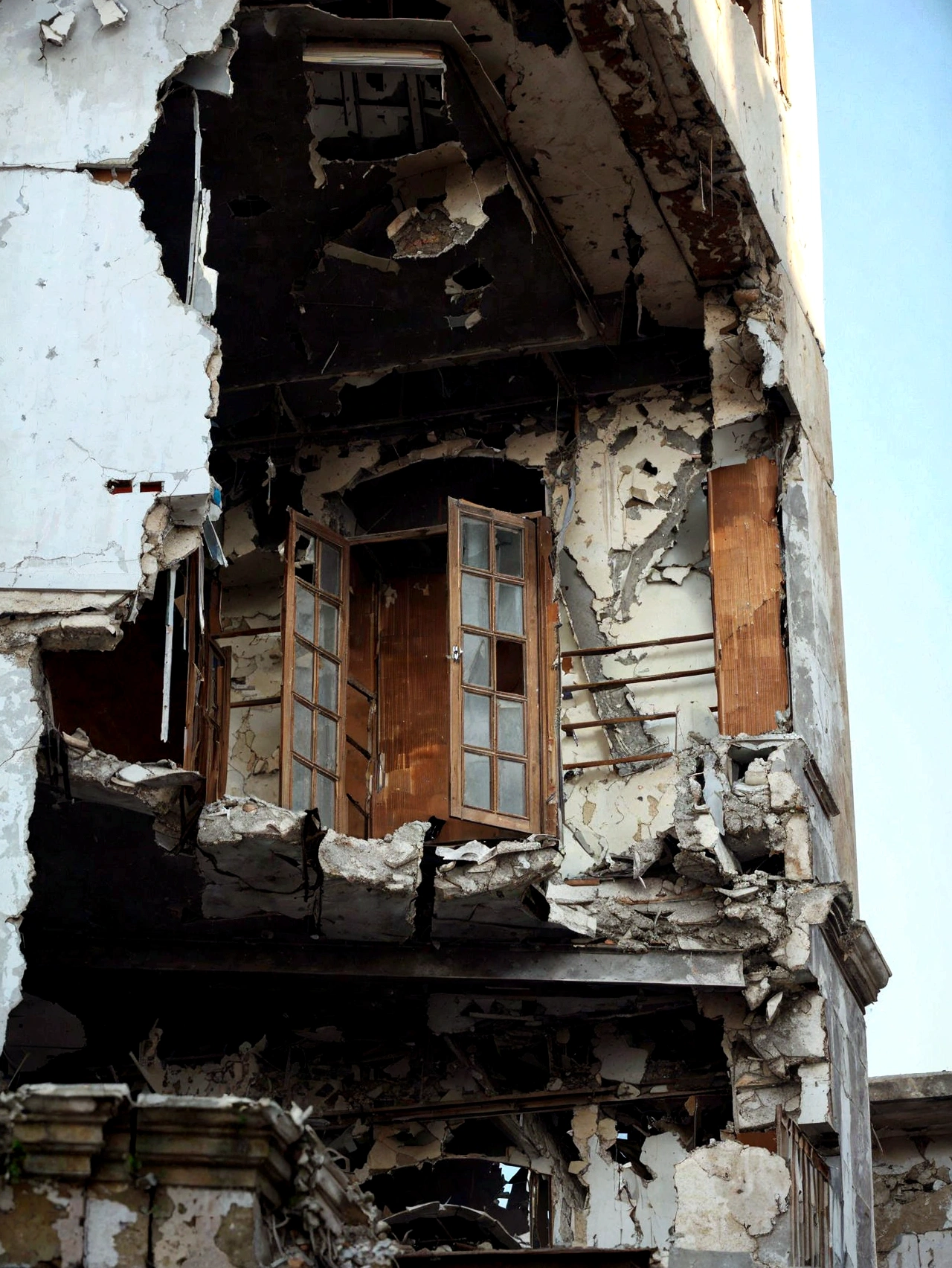 arafed building with a broken window and a broken door, building crumbling, crumbling buildings, crumbling, damaged buildings, building destroyed, damaged structures, collapsed building, destroyed buildings, broken buildings, crumbling ruins, big impact hit on the building, destroyed modern buildings, “derelict architecture buildings, wrecked buildings, dilapidated houses, ruined architecture