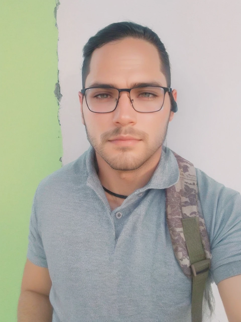 Straight, slanted dark hair, beard shadow enhance facial details 
