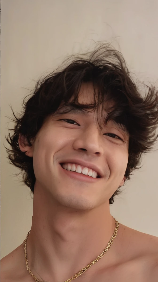 A man with delicate features with a white skin tone.
