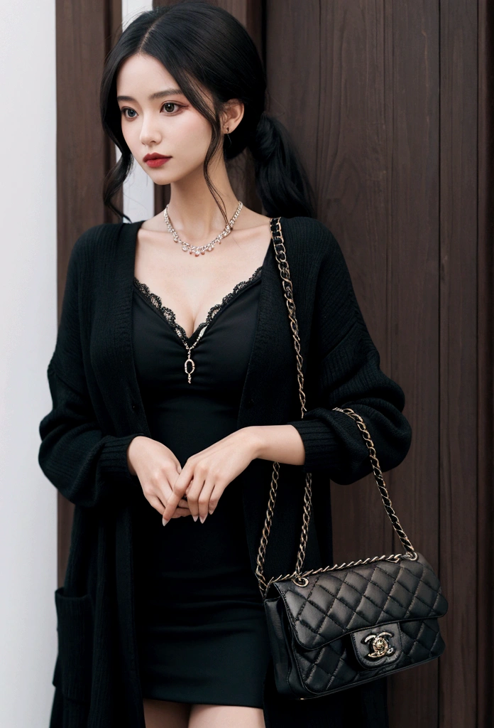 Woman in black cardigan and red dress with Chanel bag in hand 