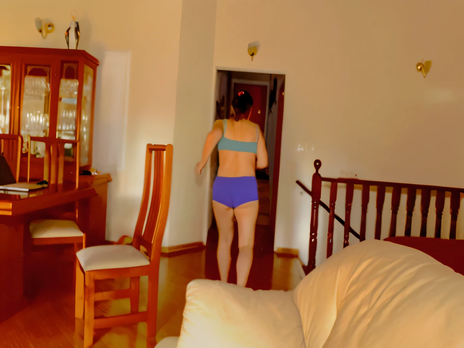 there is a woman in a bikini walking into a living room, back - shot, side shot, backview, walking away from camera, walking away from the camera, back shot, seen from the back, toned derriere, view from the back, shot from the back, from the back, picture from behind, rear-shot, backshot