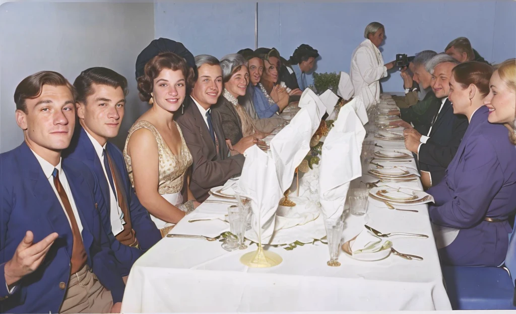 There are many people sitting at a long table with a white tablecloth, colored, color photo, a colored photo, colored photo, !!posing_as_last_cena, color photo de época, colored, old color photo, old color photograph, 1 9 6 0's, 1960, colored, colored photograph
