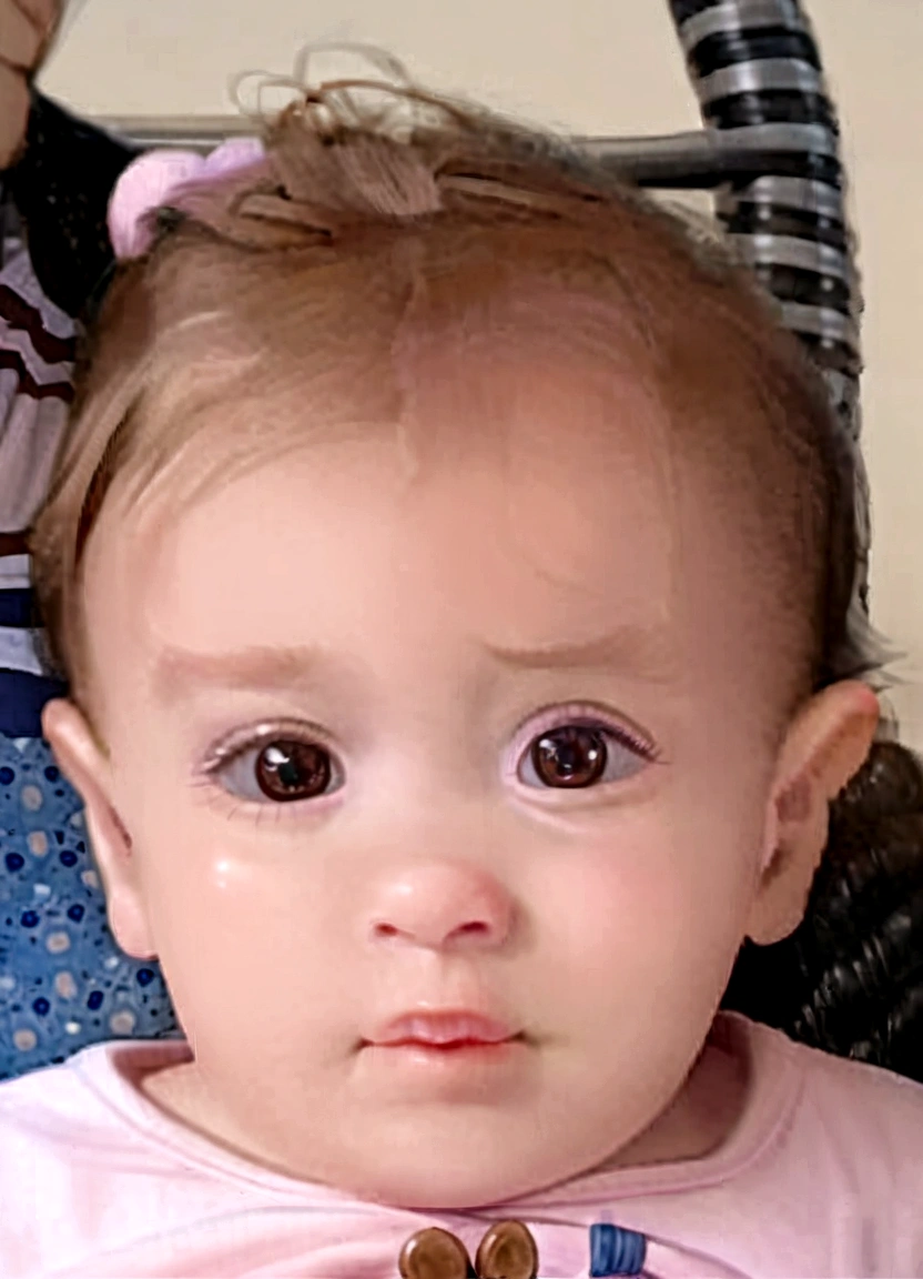 a one year old . short brown hair, beautiful and big eyes, huge brown and adorable eyes, she has a cute and expressive face, rosy cheeks, serious expression, with beautiful passionate eyes, big eyes with visible pupils