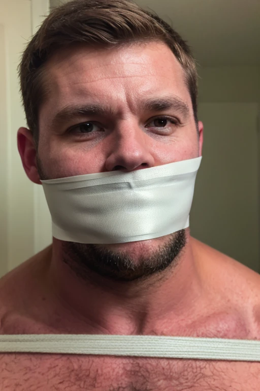 handsome middle aged man, slightly fat, stubble, bearded, hairy chest, short brown hair, looking at viewer, sad, tape gag, tape wrapped around face, tape wrapped, wrap gag, tightly bound