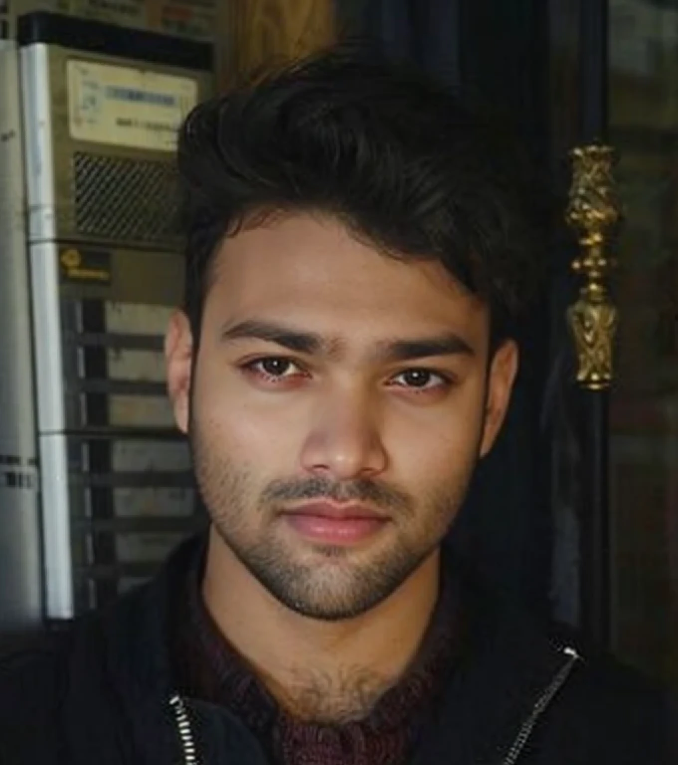 A beautiful young bearded man with highly detailed skin.