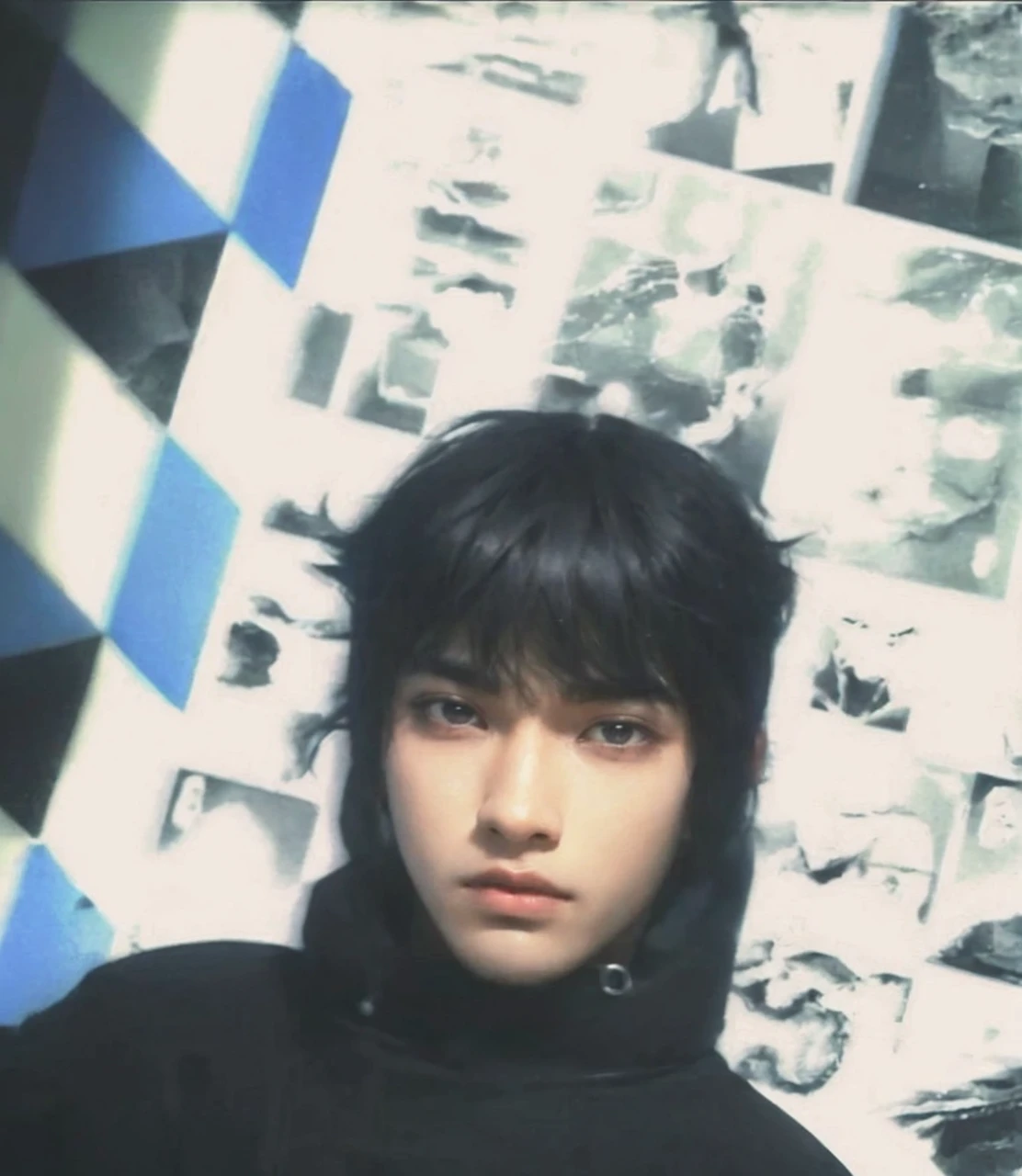a 20 yo man , Black hair ,hair slightly covered by sweater, Blank stare   (hi-top fade:1.3), dark theme, soothing tones, muted colors, high contrast, (natural skin texture, hyperrealism, soft light, sharp)