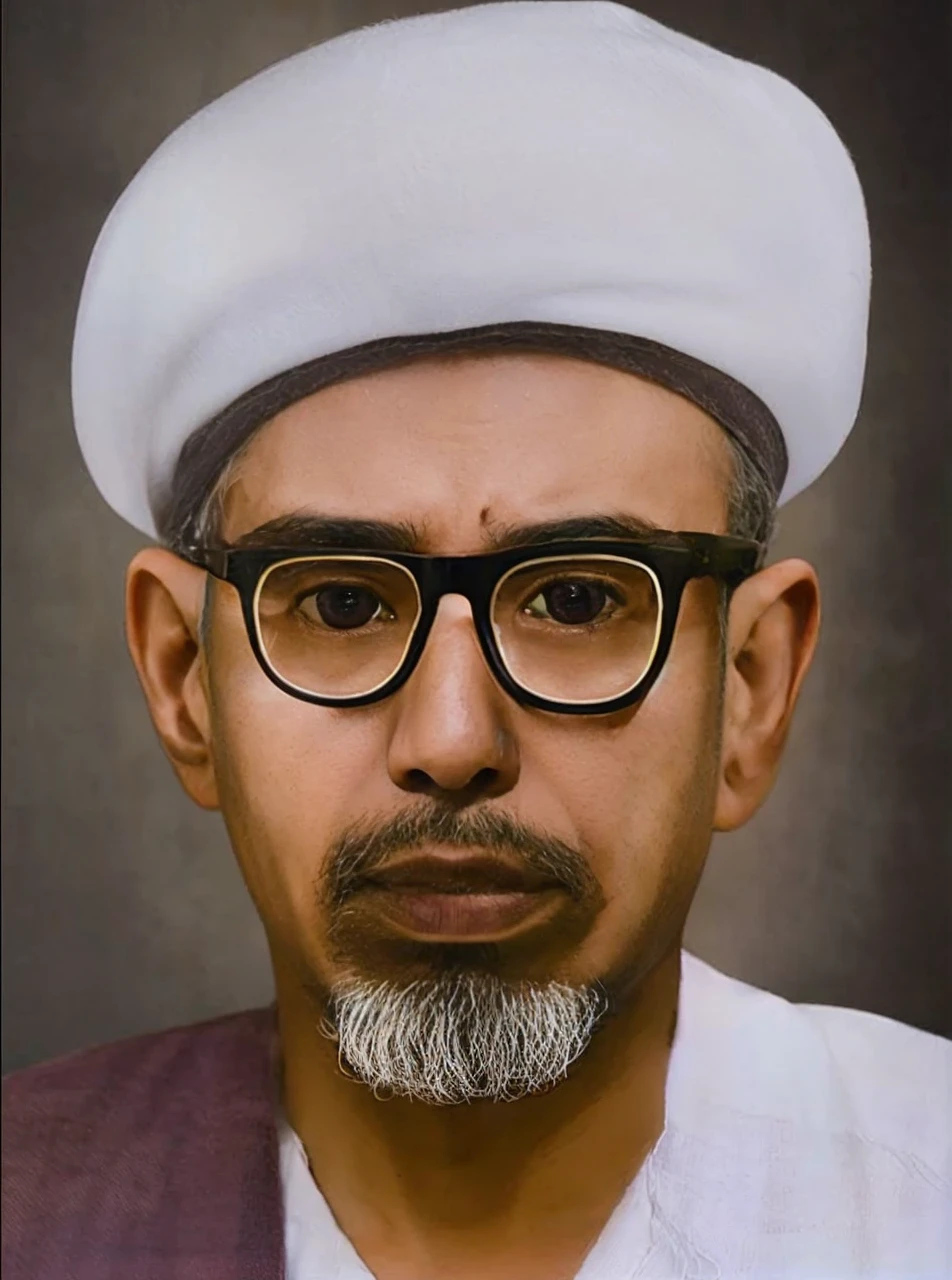 Indonesian man, aged 45 years or over, wearing a white turban, thick transparent glasses, robe and a piece of cloth on his right shoulder. Brown skin HD realistic images