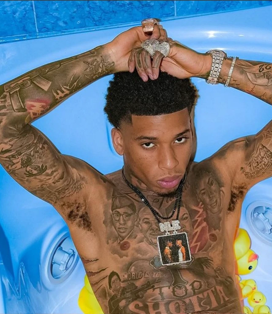 Silver iced chains around his neck