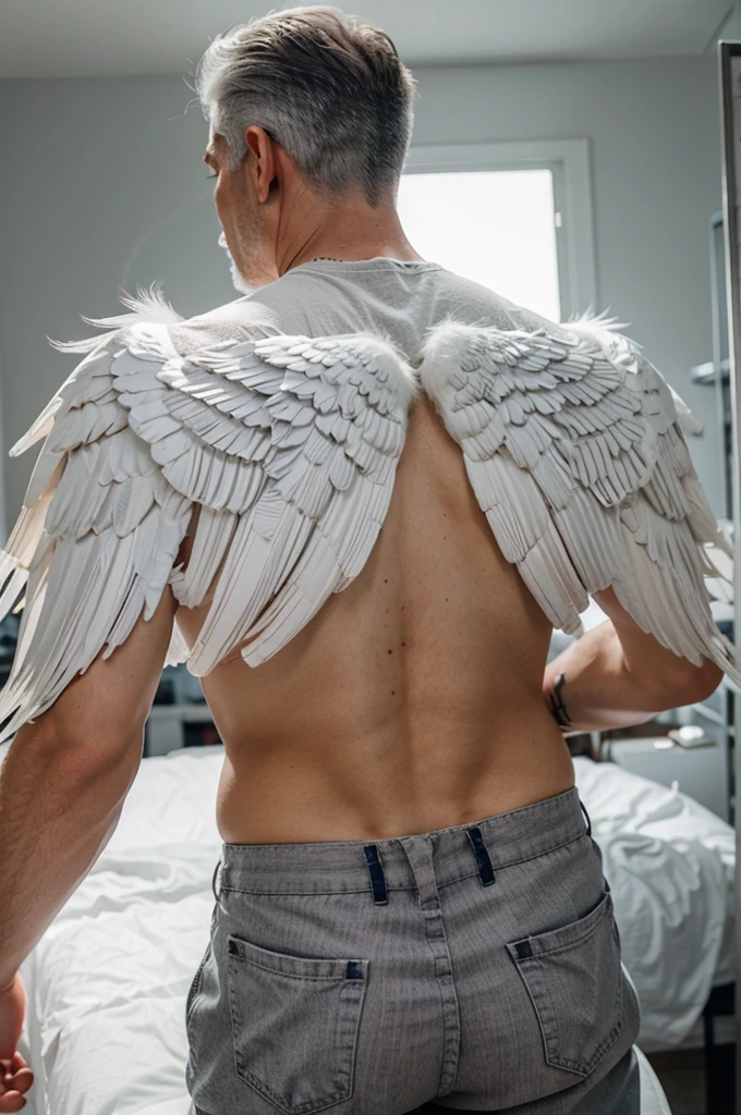 Large white angel wings on the back of a man with gray hair