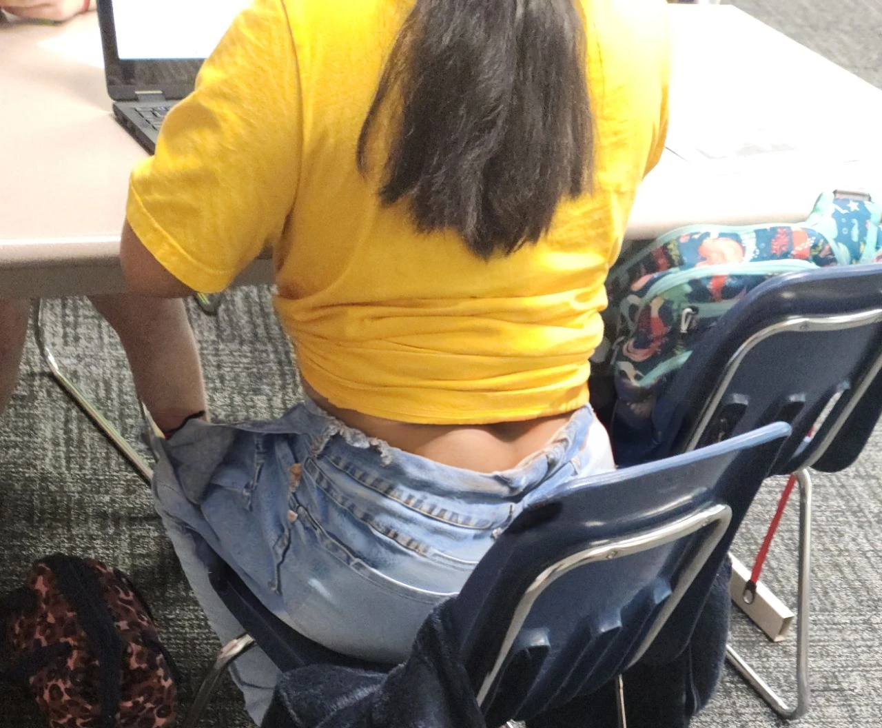 Cute tan Chinese girl wearing glasses, tight jeans, detailed , butt