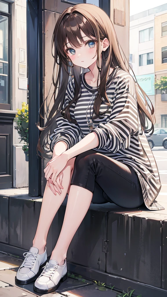 Girl with long brown hair,wearing striped shirt, black jeans and white shoes