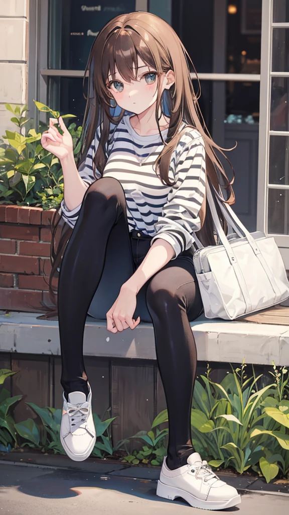Girl with long brown hair,wearing striped shirt, black jeans and white shoes
