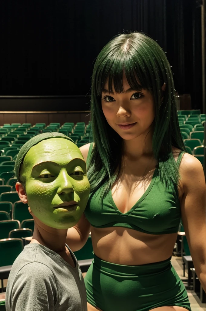 Green girl body and avocado head on a theater stage