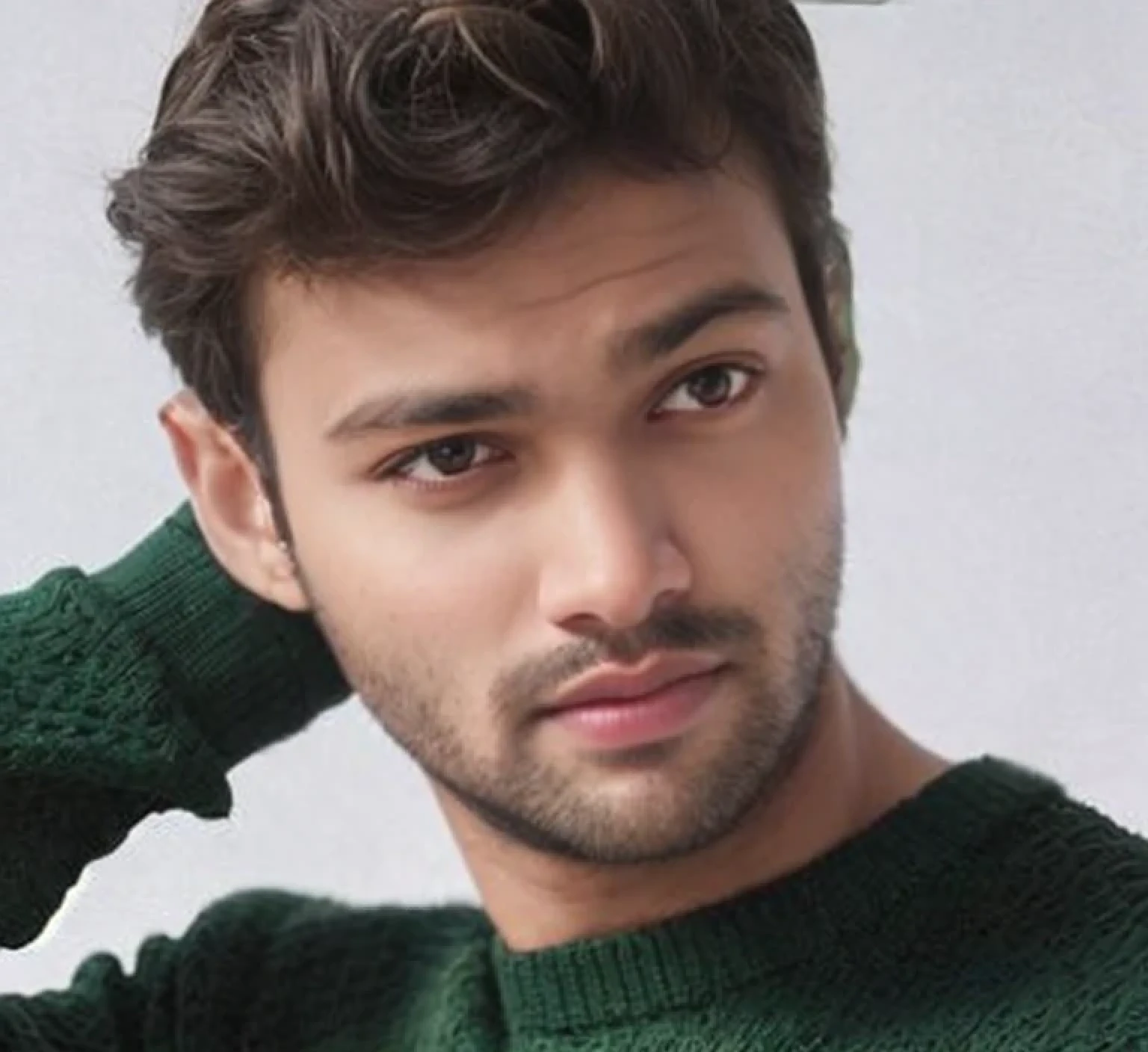 A beautiful young bearded man with highly detailed skin.quite expression