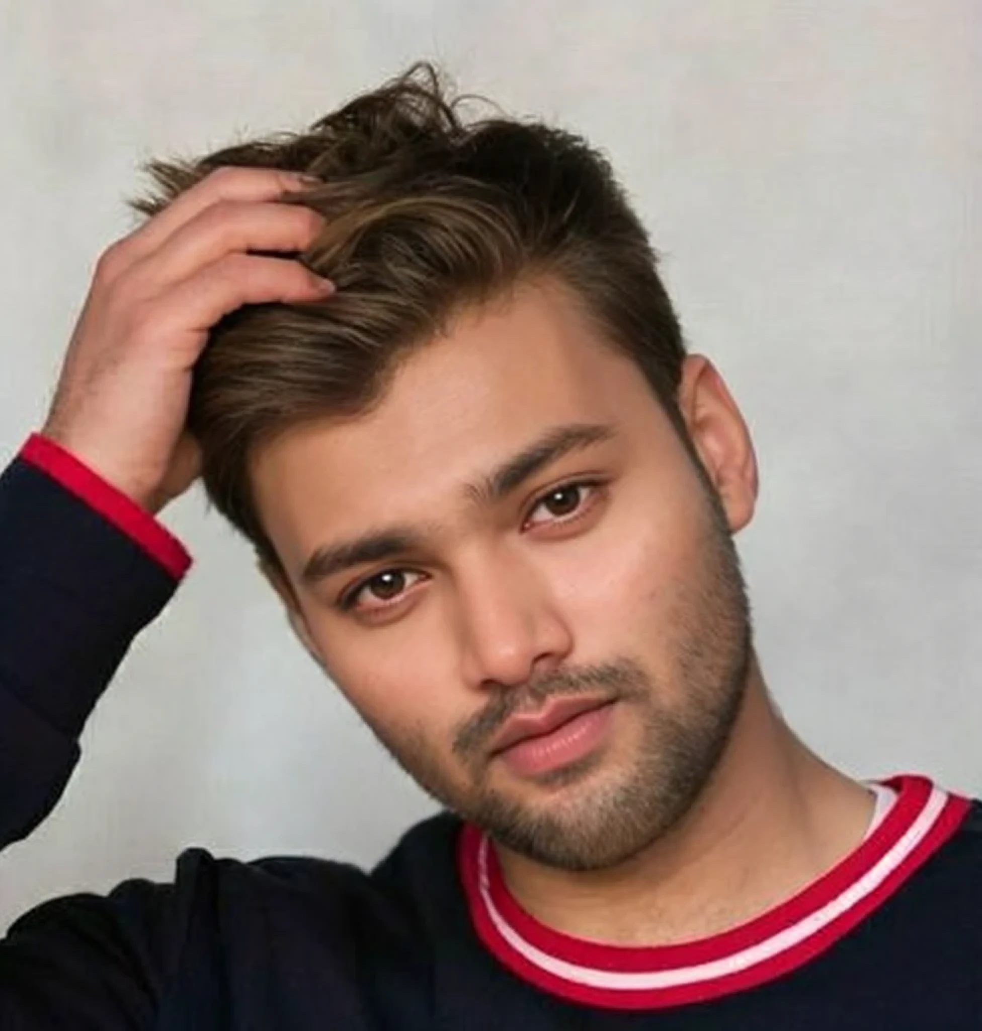 A beautiful young bearded man with highly detailed skin.