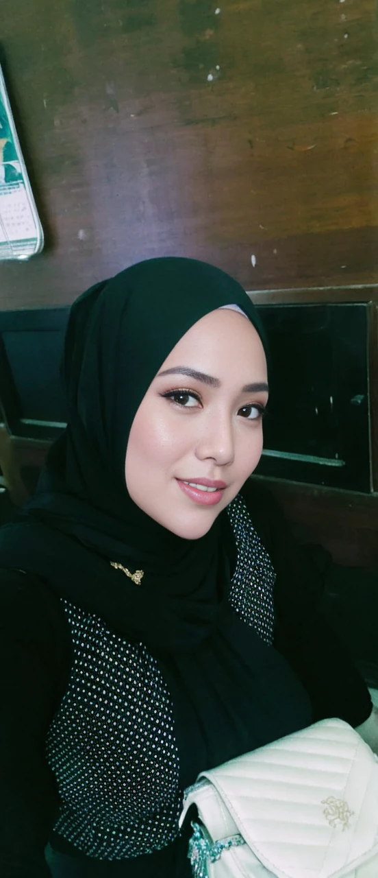 RAW, Best quality, high resolution, masterpiece: 1.3), beautiful Malay woman in hijab,Masterpiece, perfect slim fit body, Huge breast,big gorgeous eyes, Soft smile,thick thighs, a close up of a woman in a purple dress and a gold necklace, malay beauty, beautiful malay woman, draped in silky purple and gold, draped in purple and gold silk, malay princess, closeup portrait shot,, portrait shot, draped in purple, arab princess, dressed in purple, malaysian,, arab inspired , (Delicate turtleneck) , necklace, shairband, afternoon walk, City garden, Excellent lighting, Bright colors, Clean lines