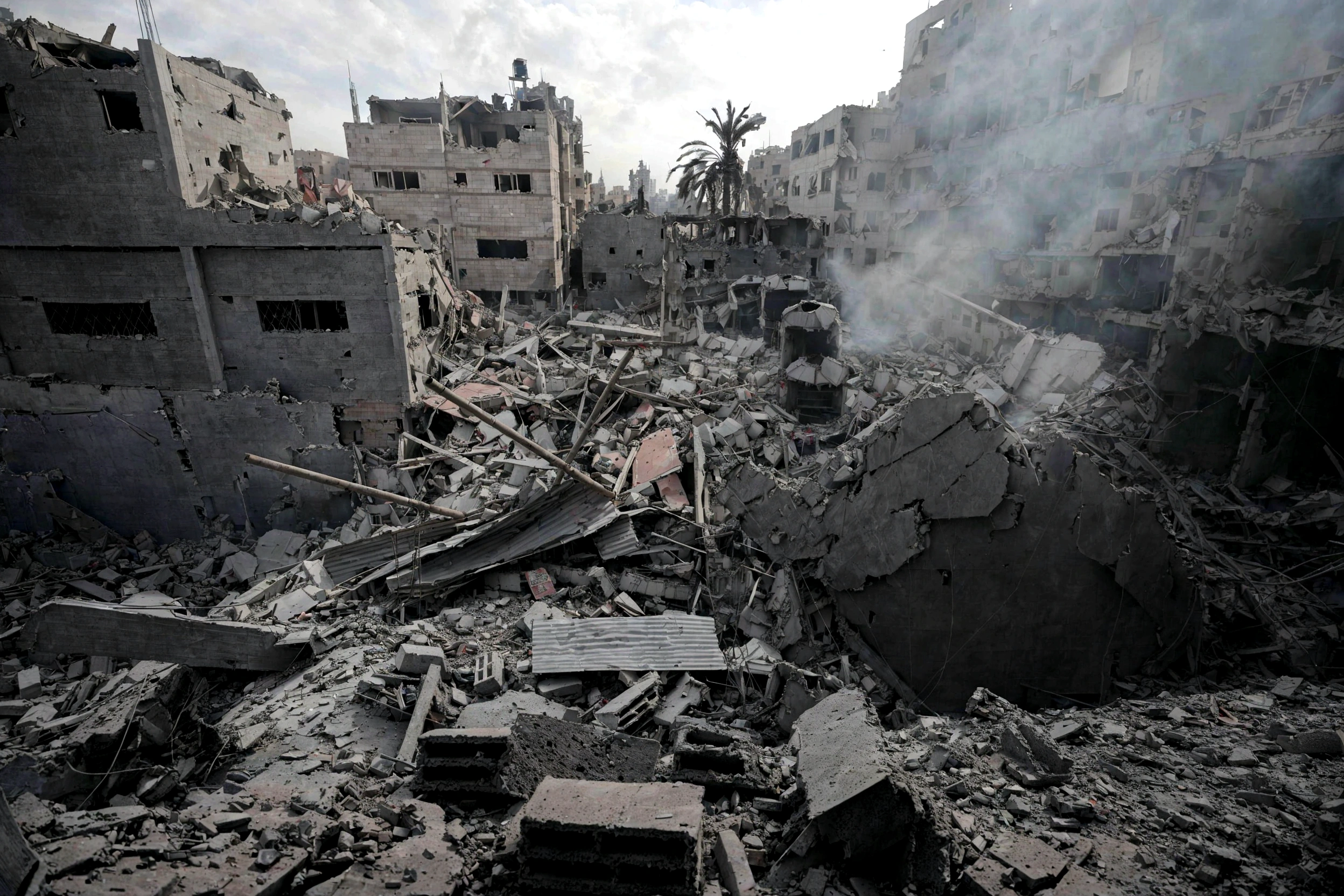 arafed building with a pile of rubble and debris in a city, destroyed buildings, building destroyed, destroyed modern buildings, collapsed buildings, wrecked buildings, rubble everywhere, smoke and rubble, damaged buildings, destroyed city in the background, destroyed human structures, photograph credit: ap, dust clouds and building debris, buildings collapsed, by Emanuel Witz, ap press photo
