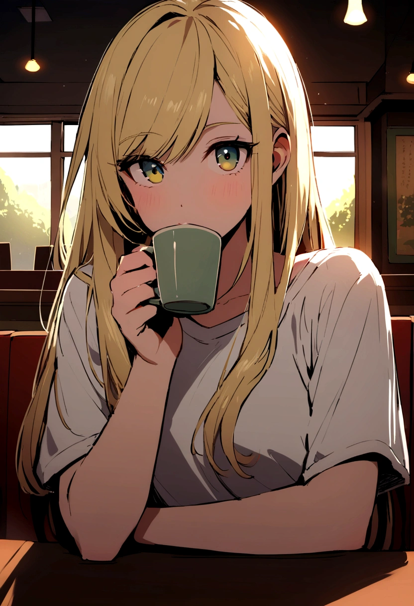 Very beautiful 22 year old blonde wearing a t-shirt looking straight into the camera sitting in a restaurant drinking tea
