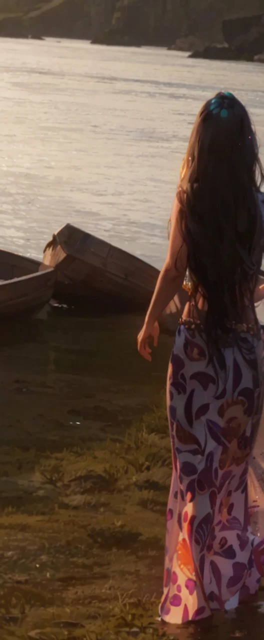 Queen Amphitrite is a medium-sized light blue mermaid with long, flowing black hair and purple hoop earrings. She has a blue tail and a belly button. She also wears a golden crown, a belt, a green bra with light purple clam shells, and two golden clasps on each of her wrists. SPARKLE; GLITTER
