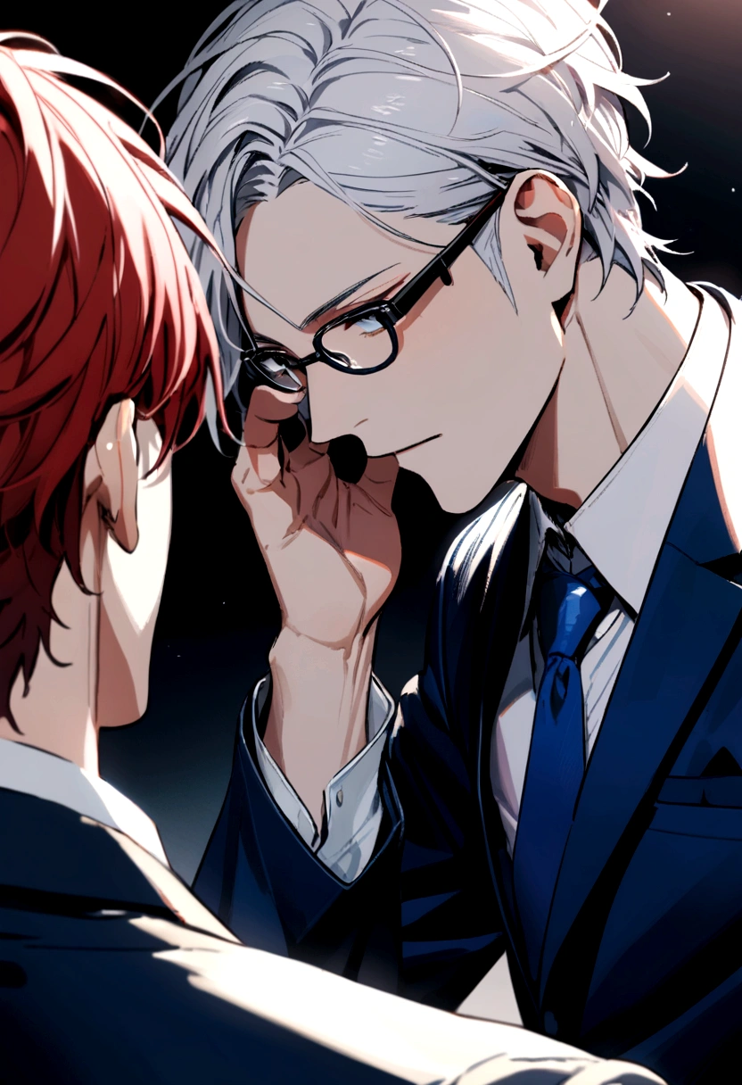 A couple of young men, one looking older, white hair, wearing a black suit, one wearing glasses and red hair. Wear a blue suit