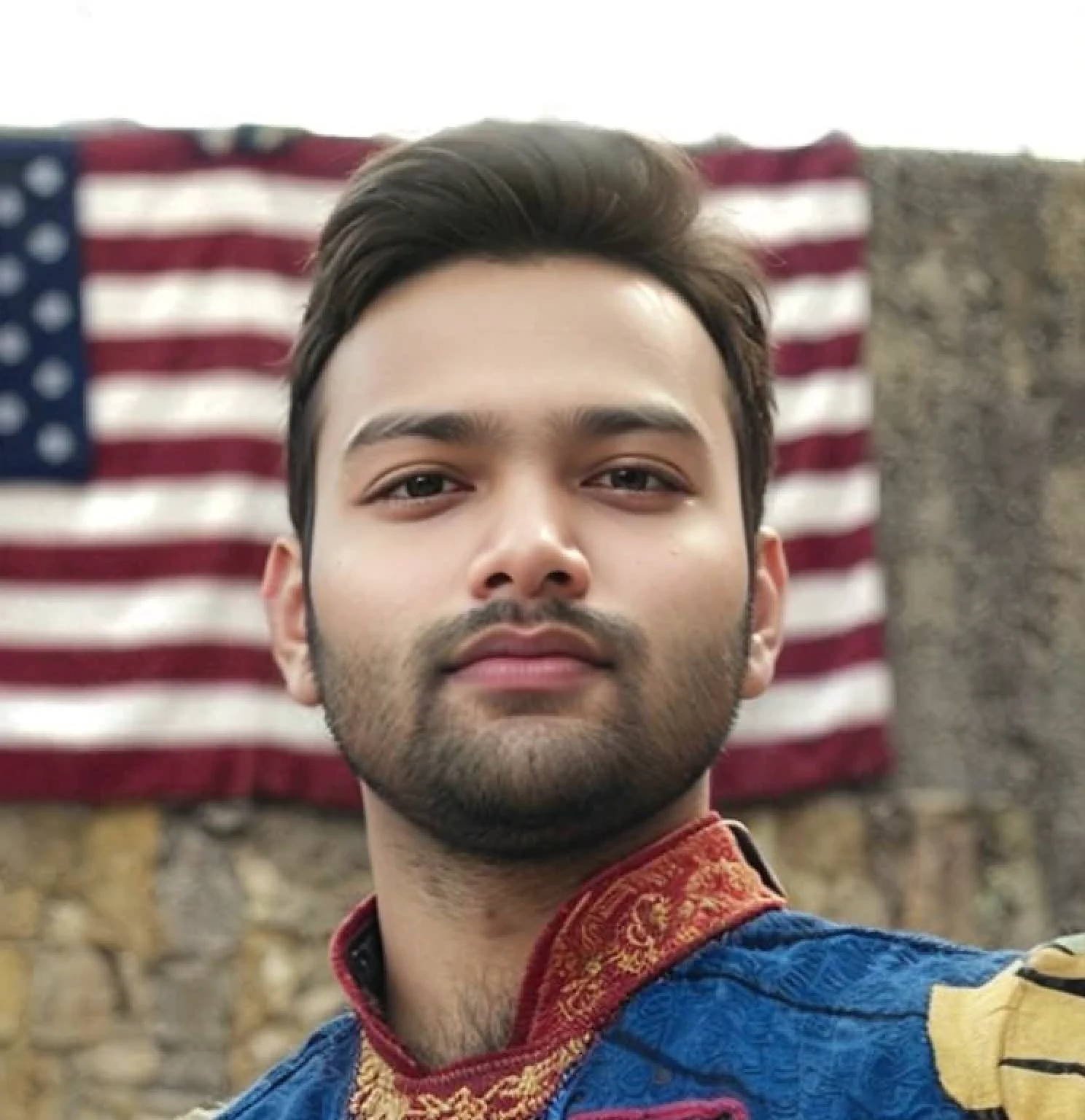 A beautiful young bearded man with highly detailed skin.black hair.