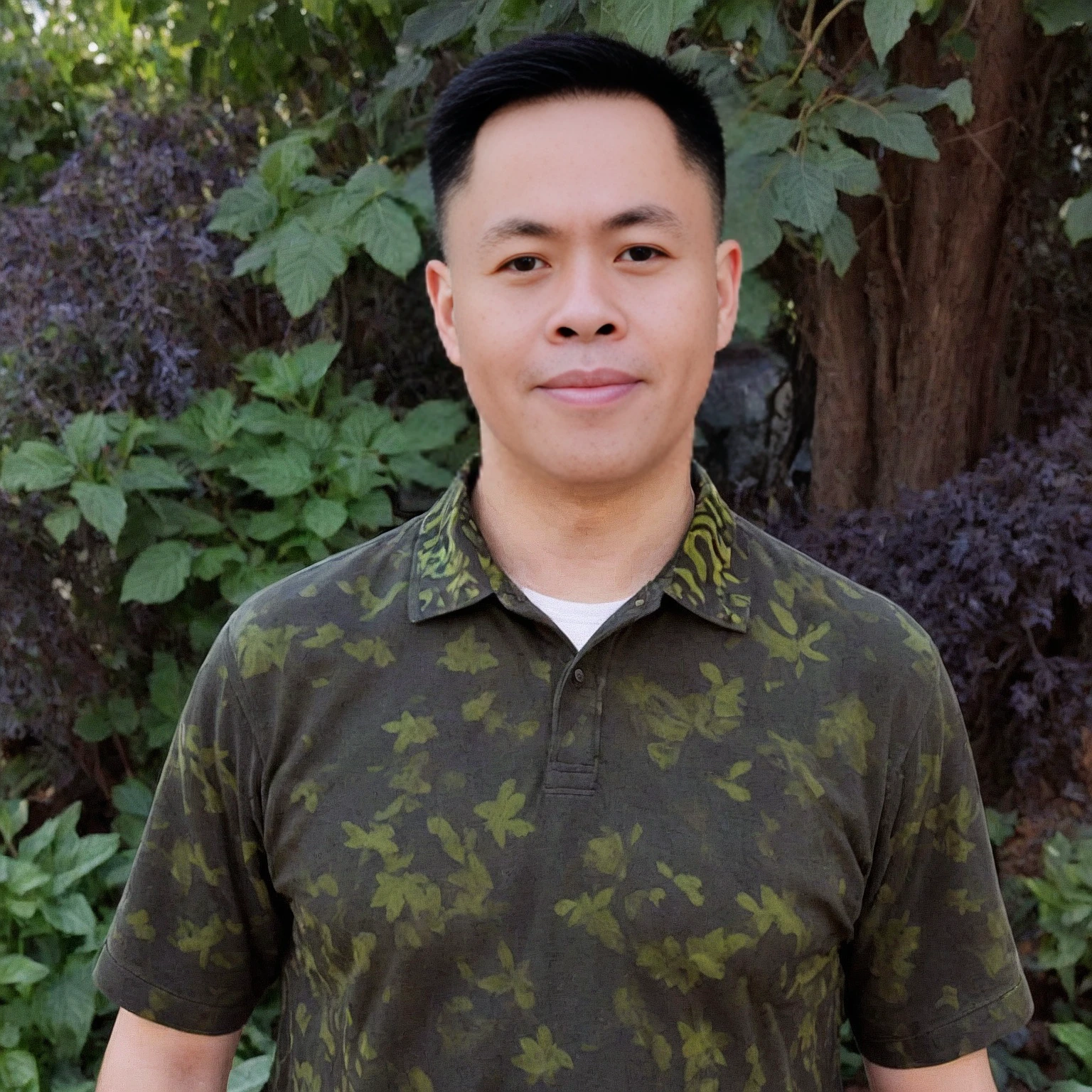 arafed man in a green shirt standing in front of a tree, david luong, andrew thomas huang, darren quach, victor ngai, christopher cao, bao pham, doug chiang, damien tran, reuben wu, michael okuda, kevin hou, jeremy cheung, peter chan, dzung phung dinh, josan gonzales, james yang