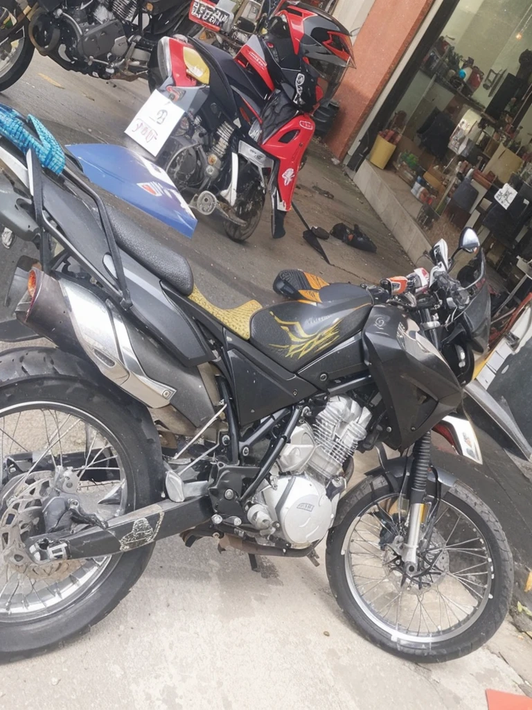 Add the linear adhesives that go on the plastic parts of the motorcycle