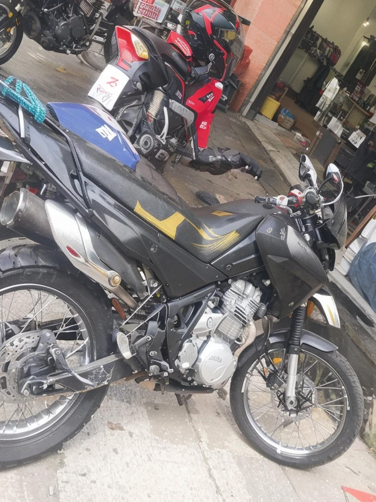 Add the linear adhesives that go on the plastic parts of the motorcycle