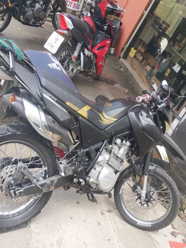 Add the linear adhesives that go on the plastic parts of the motorcycle