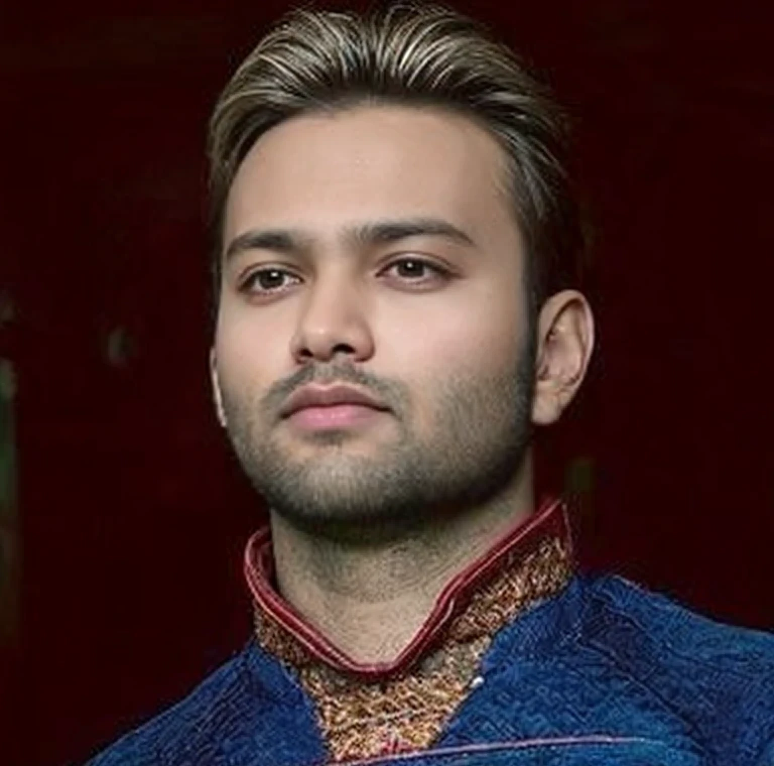 A beautiful young bearded man with highly detailed skin.black hair.